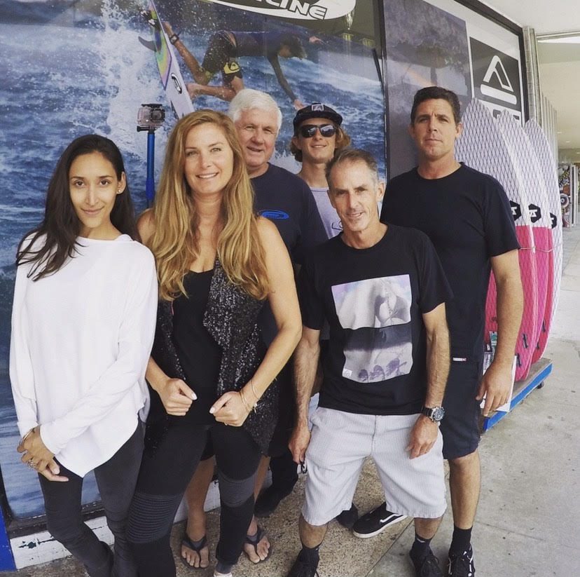 Brittney Barrios and the rest of the Freeline Surf Shop team in front of the shop in Santa Cruz